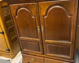 Cherry armoire/ entertainment cabinet. Two door main compartment. Two bottom drawers
