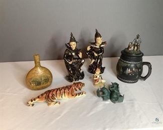 Japanese Figurines & More
Two (2) oriental figurines, crouching tiger, heavy cast metal "Three Blind Mice" reading candle holder, black stein with lid & more.