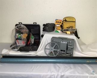 Vintage Argus Projector, JVC Video Camera and More!
Includes a Vintage Argus M500 projector with reel that comes enclosed in it's own case. A JVC Compact VHS 10X video camera that comes in it's own case and with a new cassette. Also a bag of Kodak cameras and various packages of new film. And a Da-Lite Flyer movie screen with attached tripod. Projector case handle is broken on one side. Unknown working condition of cameras, film and screen.
