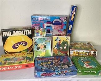 Childrens Games
Games include Mr. Mouth, Hot Wheels G-Force, Operation, Lucky ducks, The Powerpuff Girls, and Chutes and Ladders computer game. Three (3) Childrens large piece puzzles and a Baskin Robbins ice cream maker. Unknown if all items have all pieces.