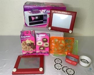 Easy Bake Oven, Light Bright, Spirograph, Etch-A-Sketch and View Master
Great nostalgic toys for kids! Includes a Light Bright, View Master with several slide disks, two (2) Etch-A-Sketch toys, three (3) Spirograph design plates and an Easy Bake Oven. The Easy Bake Oven comes with three (3) boxes (opened) of mixes. Unknown if all pieces are in the box.