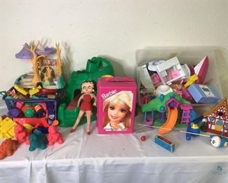 Barbies and Other Toys
Several Barbie dolls with clothes in a small Barbie storage box. Large tub of various barbie accessories. Also includes wood blocks, Fisher Price and Little Tikes tree house and mountain, and more.