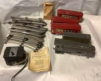 Jefferson Toy Train Set
One vintage Jefferson metal toy train set. Set includes twelve (12) metal tracks, three (3) metal cars, one (1) metal engine and one (1) transformer unit.