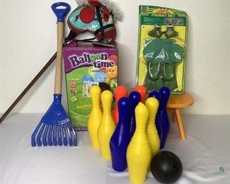 Balloon Time Helium Kit, Plastic Bowling Set and More!
One box with Balloon Time helium tank, unknown working condition. Also a plastic bowling ball set that includes ten pins and one ball. One orange painted step stool. One childrens plastic rake. One fabric horse head pony stick. And one Froggy set for kids unopened in original packaging.