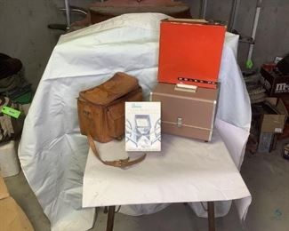 Baja Movie Editor, Bolex Movie Camera and Argus Camera
Great Vintage Cameras in great condition! Includes a Baja "Reviewer" 8mm movie editor, a Hudson Photographic Industries 35mm slide sorter, a Bolex P4 Zoom Reflex automatic movie camera (looks new in original box). Also a Argus 500 Electromatic slide projector. Then a leather camera case with an Argus F2.8 50mm camera in its own leather cover case, lots of extra filters and lenses as well as a Kodak Zoom 8 camera. Leather case strap is broken due to aging