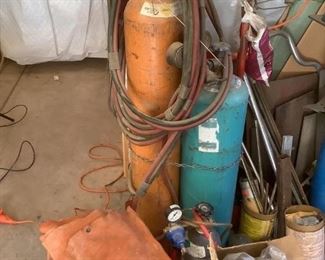 Welding Equipment & Tanks
Two (2) welding oxygen & acetylene tanks (one H48" and one H36"). Includes hoses, gauges, helmet, goggles, gloves, tools, etc. See photos for sampling.