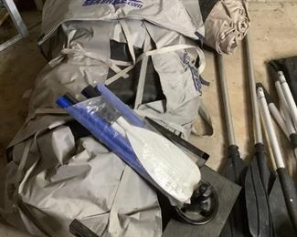 Sea Eagle Inflatable Raft and More!
One Sea Eagle inflatable raft rolled up into it's canvas cover, several sets of oars, boat anchor, inflator pump and more! Unable to unroll raft and other inflatable item due to lack of space. Unable to confirm working condition of those items and the pump. Raft includes hard plastic pieces for bottom and what appears to be a canopy. (Unknown if all pieces are present).