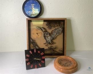 Clocks
Four (4) clocks: Large owl clock in wood frame H21" x W21". Round wood frame clock by Jaxson (12" diameter). Round blue plastic framed clock of lighthouse scene (10" diameter). Square black plastic clock "Las Vegas" with red dice indicating hours (12" square). Unknown working condition.