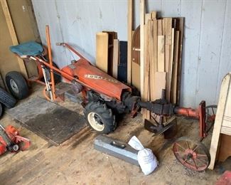 Vintage Gravely Tractor
Gravely Vintage Model LI, Serial M66640, Mfg. #E-3565. Includes extra tires, chains, tool box & tools, gas cans. Unknown working condition. Steel tires in front, H30" x W22" x L10'.