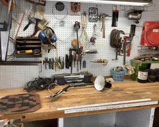 Wall of Tools
A wall of various tools. Includes saws, paint brushes, Sabre saw, C clamps, extension cords and more! Also includes a metal shop chair, clip boards and more! Note: peg board is not included