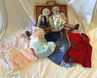Antique Raggedy Ann and Andy and a Basket Full of Doll Dresses