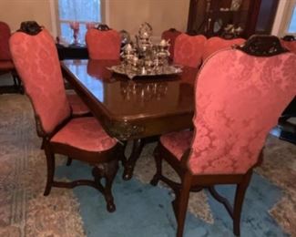 Antique Mahogany Dining Table w/8 Leaves. $1,200.           12 Antique upholstered Dining Chairs (2 arms 10 sides) $1,800