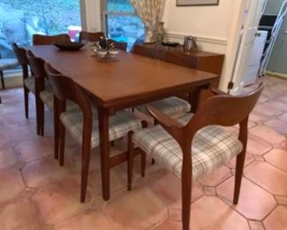 Danish Modern Designer Niles Otto Moller drawleaf dining table w/10 (2 arms, 8 sides) chairs. $6,000