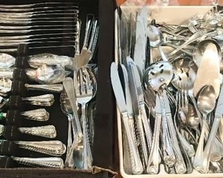 Two sets of stainless flatware