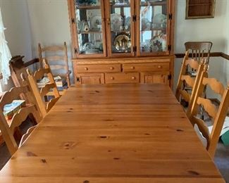 Solid pine harvest table and 6 chairs by Kincaid Furniture.  Perfect for dining room or breakfast room.  There are two leaves and a padded cover for table.