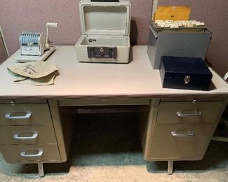 Metal office desk.  Also, there is a paymaster machine, small paper safe, and 2 file boxes that are for sale.