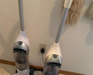 Pair of electric vacuums.  Also available floor scrubber, and full size vaccums plus electric broom.