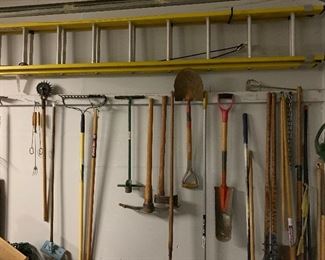 Like new 24' extension ladder and an asssortment of garden tools.
