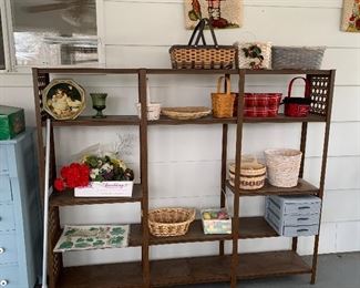 Wall shelf with baskets and storage boxes.  