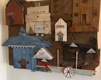 Wood three dimensional riverside town wall decor.