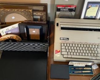 Vintage typewriter and photo frames