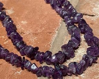 $40; single, long strand of amethyst stones