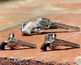 $40; pistol cuff link set            $20; revolver tie clip