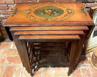 $400; beautiful & ornate antique set of four nesting tables; top table has hand painting and drop leaves; largest 27”w x 15”d x 26”h (with leaves open 41”w); smallest 17”w x 11”d x 24”h