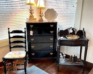 $100; Black and gold lacquered, ladder-back chair with custom, floral upholstery; 19”w x 17”d x 43”h;      $400 antique black and gold lacquered tall boy with ornate, brass, scroll handles and five drawers; 33”w x20”d x 47”h;        $140; 2-tiered, black, cane-front buffet console table with storage drawer; has some condition issues; 27”w x 16”d x 42”h