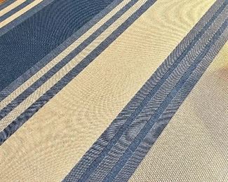 SOLD $150; indoor/outdoor rug with blue and ivory stripes; has been used inside only; 7’ x 11’