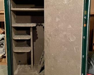 interior of gun safe showing lined shelving