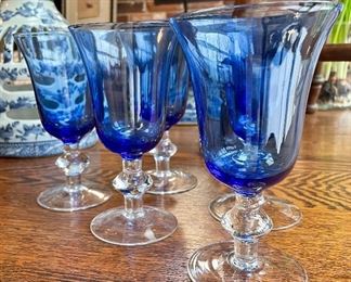 SOLD $12; set of blue glasses with clear bases; 6.5”h