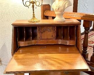 view of secretary open showing cubbies