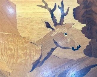 close up of inlaid wood detail from table