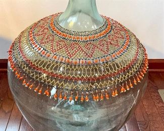 $80; hand-made, beaded, African wedding necklace;     $60; extra large, green glass bottle; 16”d x 24”h