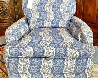 $500; antique, low-profile, custom upholstered chair with low roll arms and hand-carved footing and headrest; 29’w x 34”d x 31”h