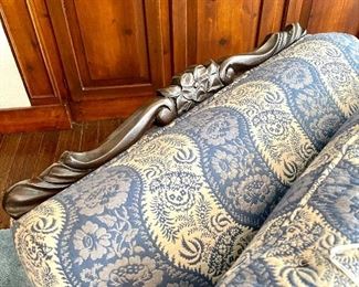 close up of arm chair’s carved headrest