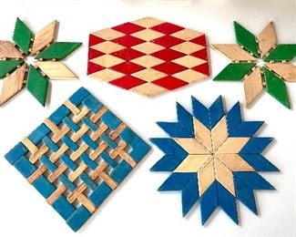 $26 each; mid-century modern wooden trivets; varied colors and shapes