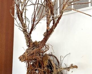 SOLD      $80; vine and stick deer sculpture wall hanging; dusty but a staff favorite! 24”w x 20”d x 40”h