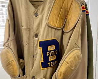 SOLD        $100; vintage Rifle Team jacket with leather elbow pads and shooting shoulder; plus Jr. NRA patches on back;          other vintage uniforms and hunting wear available at sale