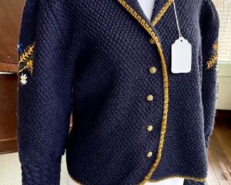 $40; blue, sweater with puffy sleeves, mustard trim and floral design on the sleeves; size unmarked