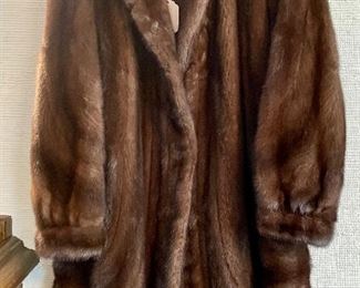 $400; fur by Grosvenor with lapel and cuffs and curved front edges; size not indicated (medium-large)