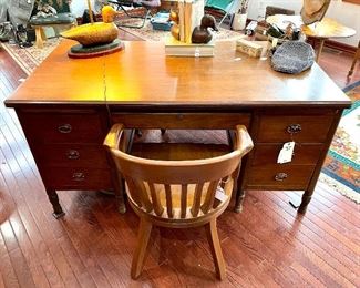 $200; vintage wood executive desk with pencil drawer and five other drawers; some scratches and wear on top; 60”w x 32”d x 31”h