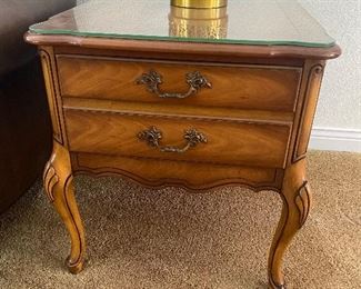Two end tables with glass tops 