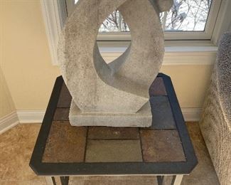 Sculpture with metal table and tile top