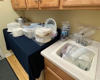 Plasticware (paper plates, forks, knives, spoons, cups, napkins.  Candles, covered cake plate