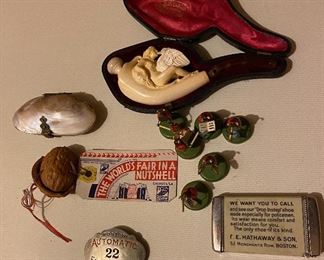 Pipe, Firemen's badge, advertising match safe, lady bug band and World Fair Nut