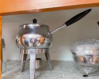 lots of fondue and other serving dishes