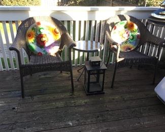 Wicker Style Arm Chairs, Colorful Decorative Glass Disc, Lantern, Round Glass Side Table.