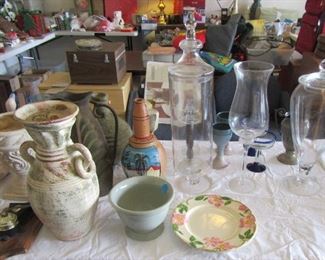 Assorted glassware and pottery and other garage items.